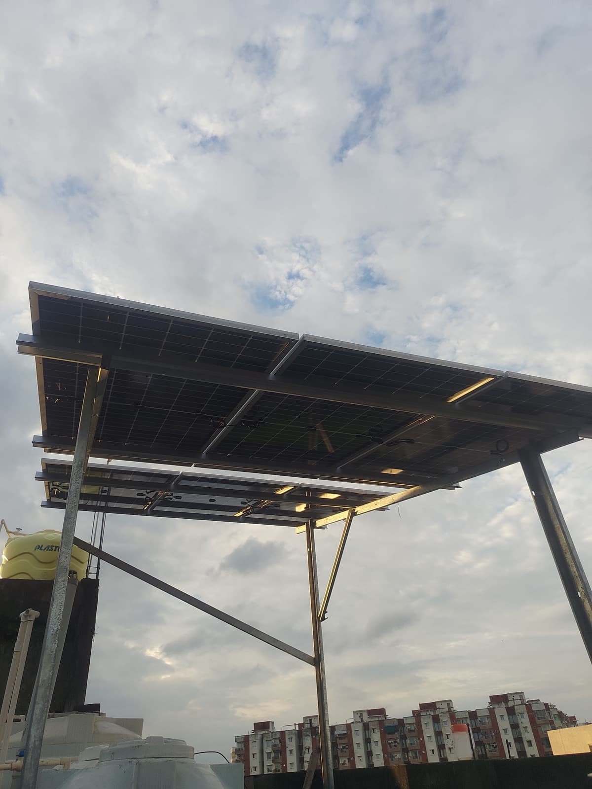 Elevated rooftop solar structure at golden hour — Suryam Tech installation